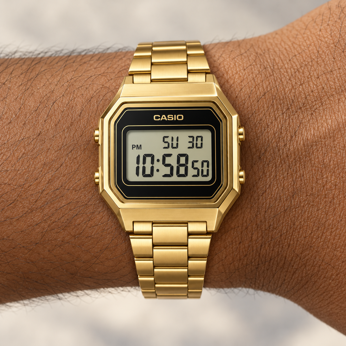 Casio Variant — Retro Digital Gold — wrist closeup view